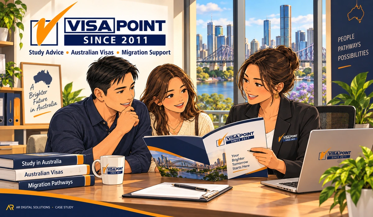 Amann walking the Visa Point team through their rank-tracking report on a large monitor, the result line highlighted; the client's workplace visible.